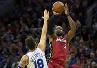 Dwayne Wade shooting over Belleneli